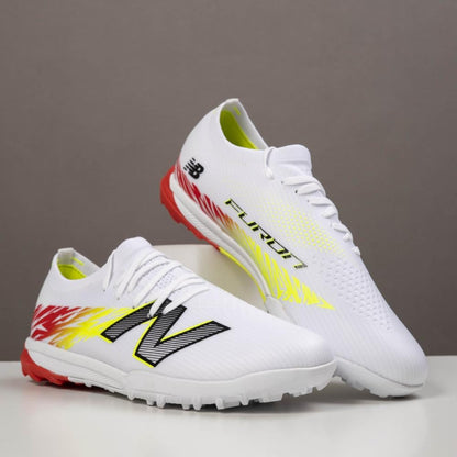 NEWBALANCE TAKELA CHAUSSURE DE FOOTBALL TF
